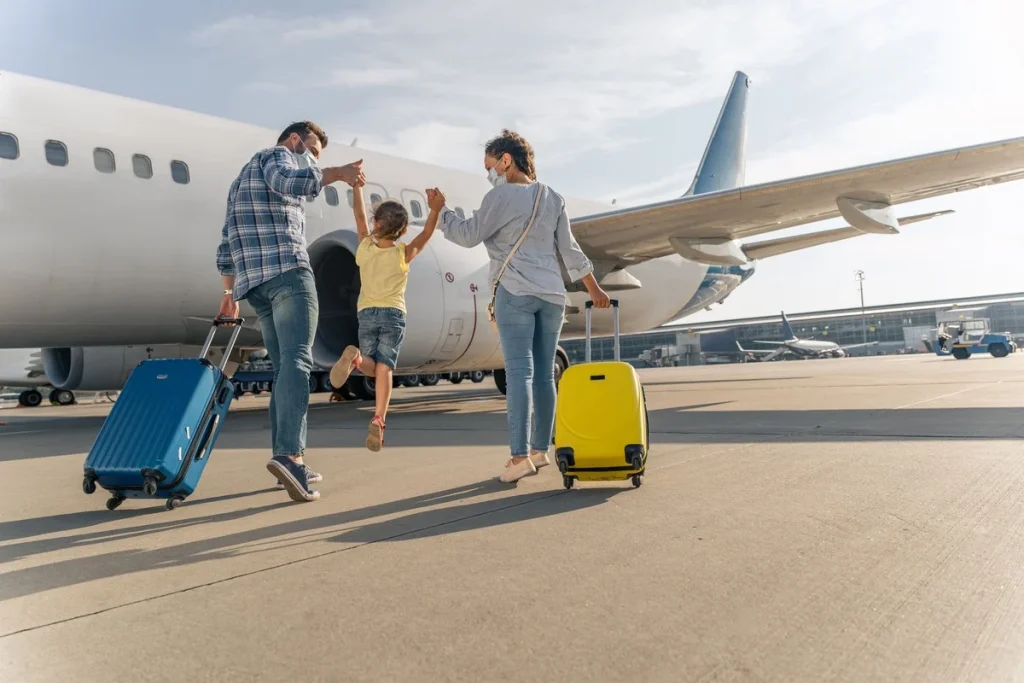 Отказ в посадке на рейс - Back-View-Of-Happy-Family-Boarding-A-Plane-Ahead-Of-International-Travel