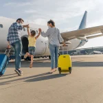Отказ в посадке на рейс - Back-View-Of-Happy-Family-Boarding-A-Plane-Ahead-Of-International-Travel